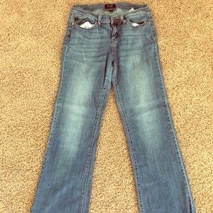 Judy Blue distresses jeans.
